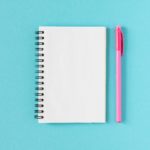 Notepad on blue background